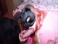 Redhead sucks on porn dog's cock